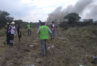 Rescue workers near the site of an Aeromexico crash in Durango.