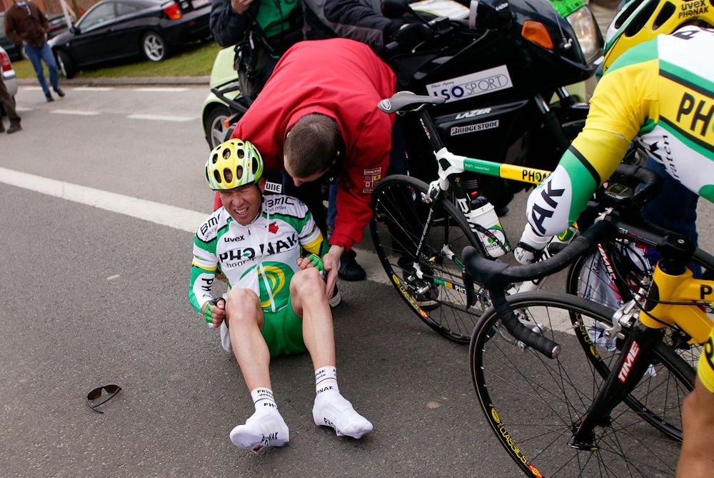 A Phonak rider is attended to after a crash.