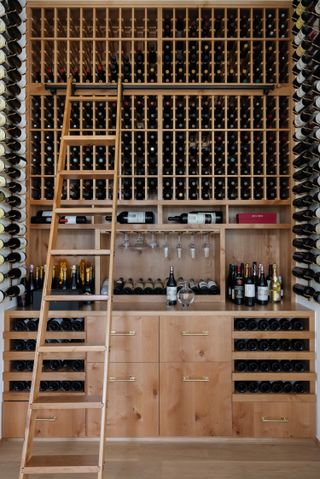 A wine room with floor to ceiling wine rack