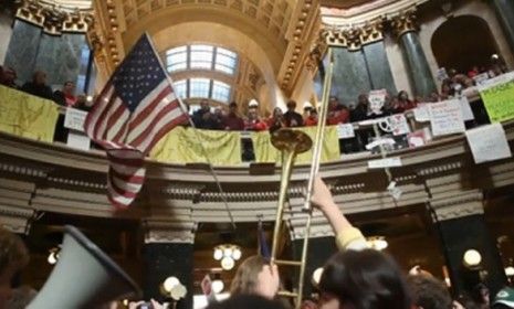 Michael Wisniewski is a 23-year-old University of Wisconsin staffer, captured the passion of the protesters in two viral videos.