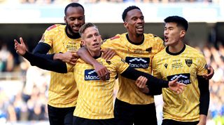 Sam Corne celebrates with his Maidstone United team-mates after scoring against Ipswich Town in the FA Cup in January 2024.