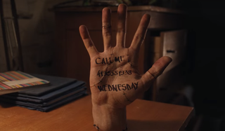 Thing with a message that reads "call me, Wednesday"