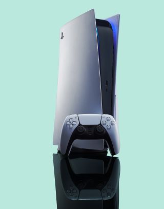 The PS5 shown with controller in vertical orientation against a grey backdrop.