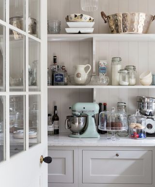 Open shelves, mixer, storage jars and containers