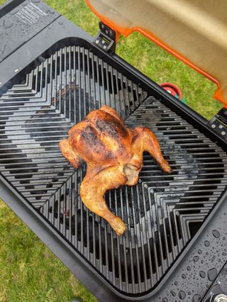 spatchcock chicken cooking on an everdure force 2 gas grill