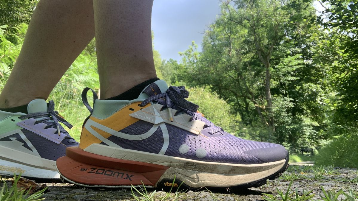 Runner&#039;s feet wearing the Nike Zegama 2 shoes on the trail