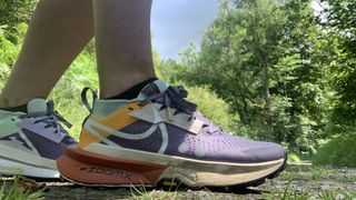 Runner's feet wearing the Nike Zegama 2 shoes on the trail