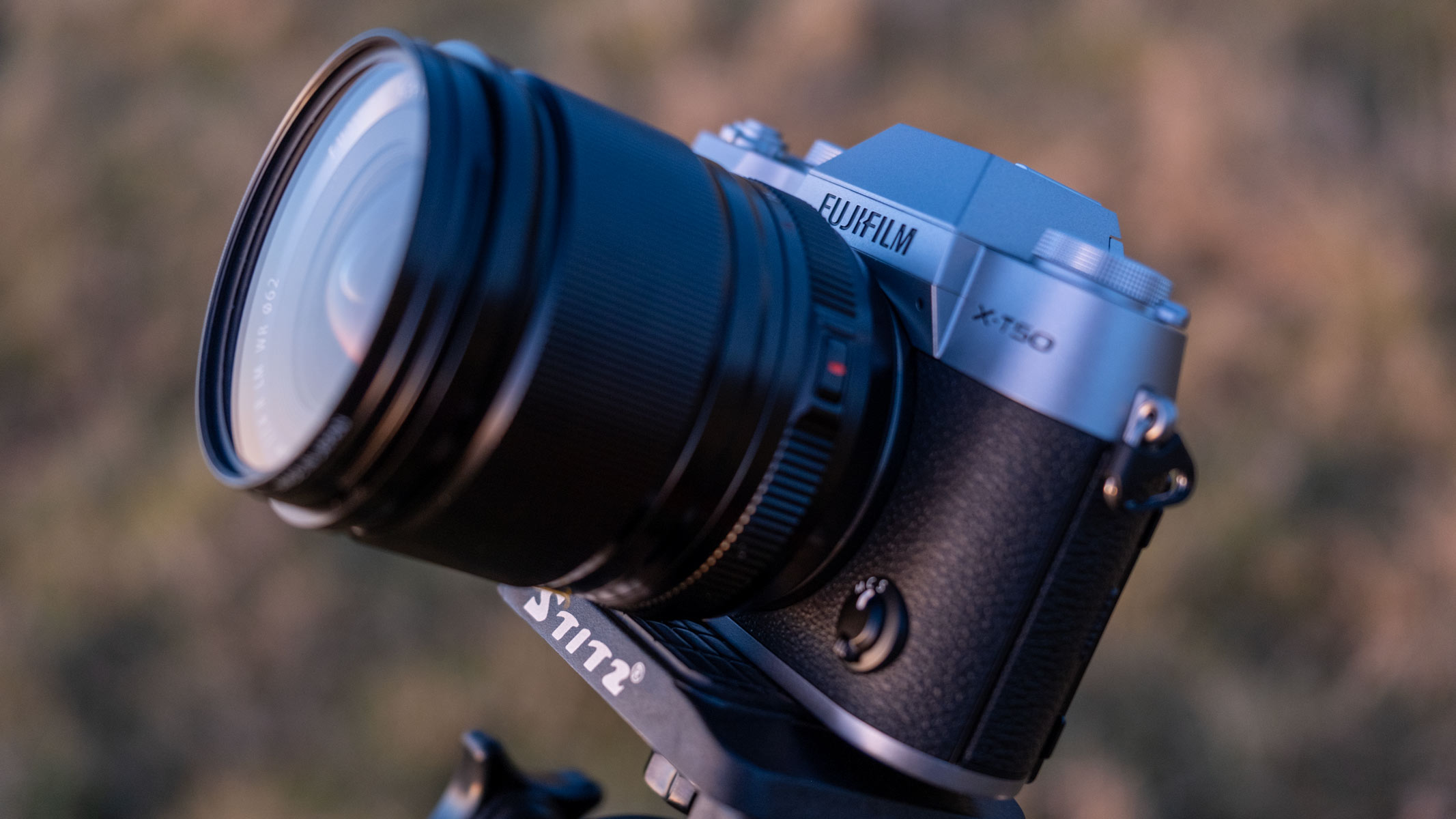 The Fujifilm X-T50 with an 18mm f/1.4 lens on a tripod aiming at the sky