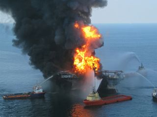 Platform supply vessels battle the blazing remnants of the off shore oil rig Deepwater Horizon. A Coast Guard MH-65C dolphin rescue helicopter and crew document the fire aboard the mobile offshore drilling unit Deepwater Horizon, while searching for survivors. Multiple Coast Guard helicopters, planes and cutters responded to rescue the Deepwater Horizon's 126 person crew.