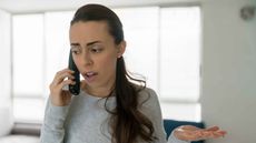 Photo of woman complaining on the phone