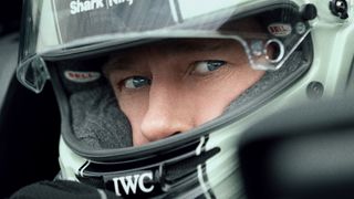 A close-up of Brad Pitt in a racing helmet in Apple's 'F1' movie