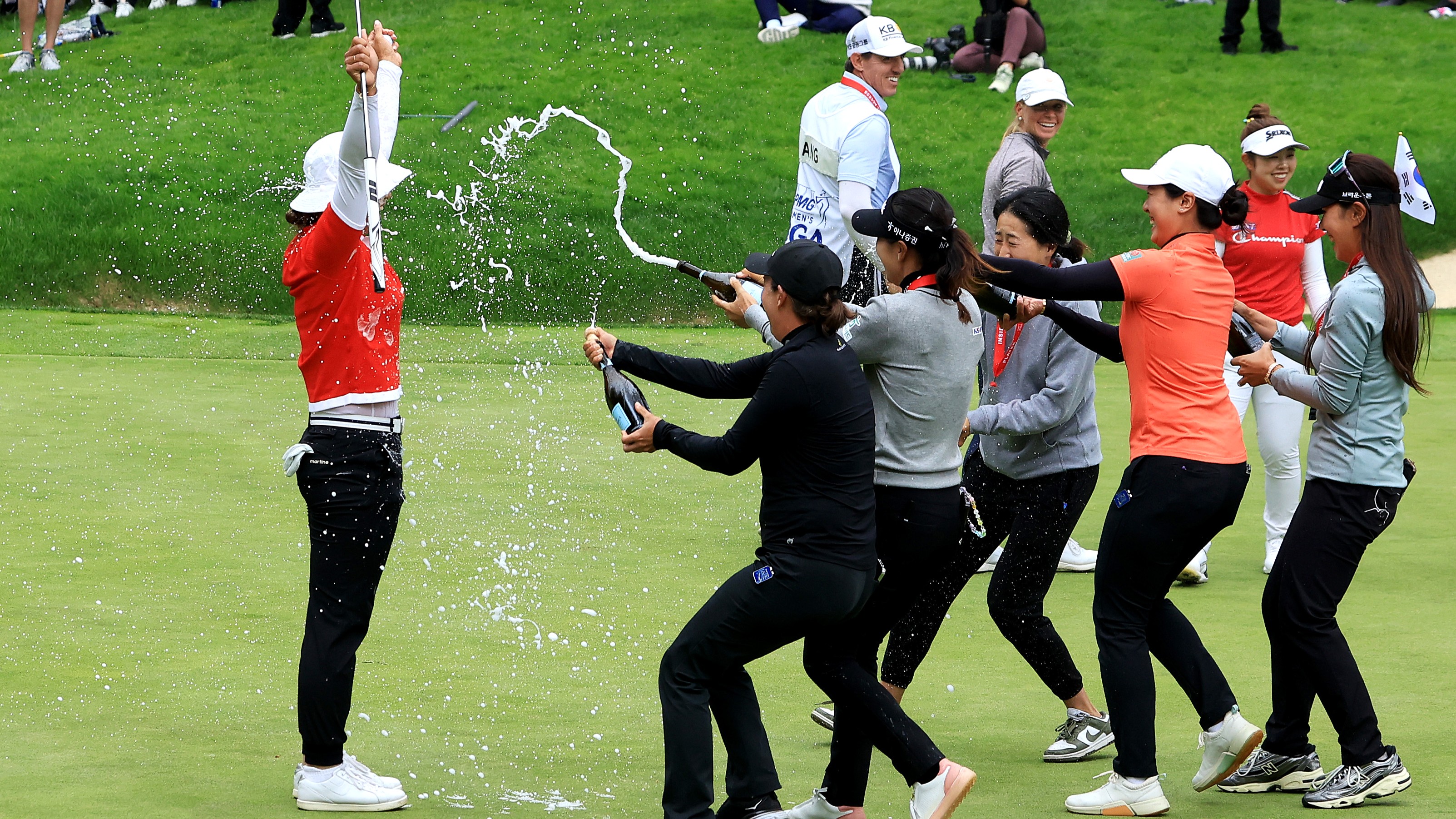 Amy Yang of South Korea is showered with champagne by fellow players after winning the KPMG Women&#039;s PGA Championship at Sahalee Country Club last year