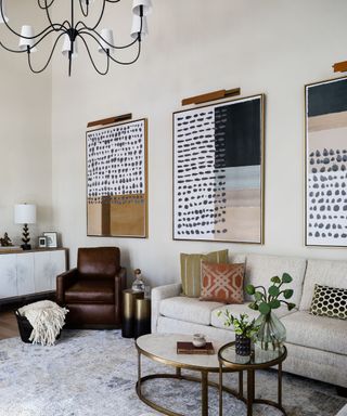 Cream living room with a cream sofa and artworks in muted hues