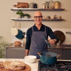Stanley Tucci in a kitchen with his TUCCI by GreenPan cookware