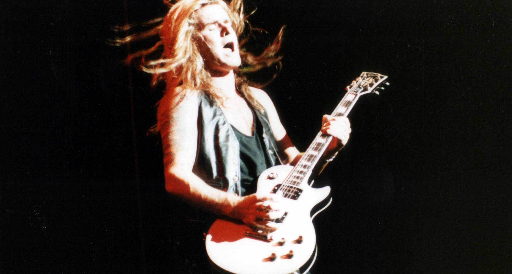 Billy Duffy of the Cult plays his Les Paul Custom live onstage in Paris, 1989.