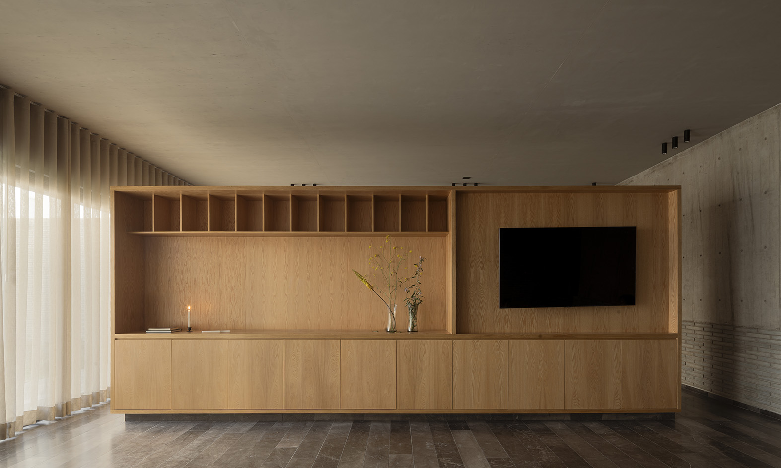 Mexican house designed as a refuge, tall walls, blind from street, plants and minimalist serenity inside