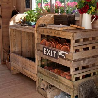 reclaimed palettes used to make a pot storage shelf