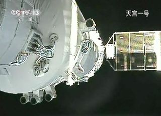 Video still showing China's Shenzhou 8 spacecraft docked with the Tiangong 1 lab module on Nov. 3, 2011.
