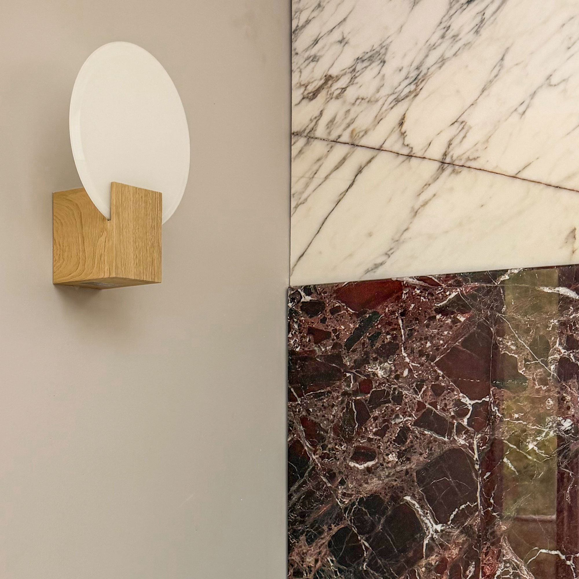 Close up of wall light beside marble