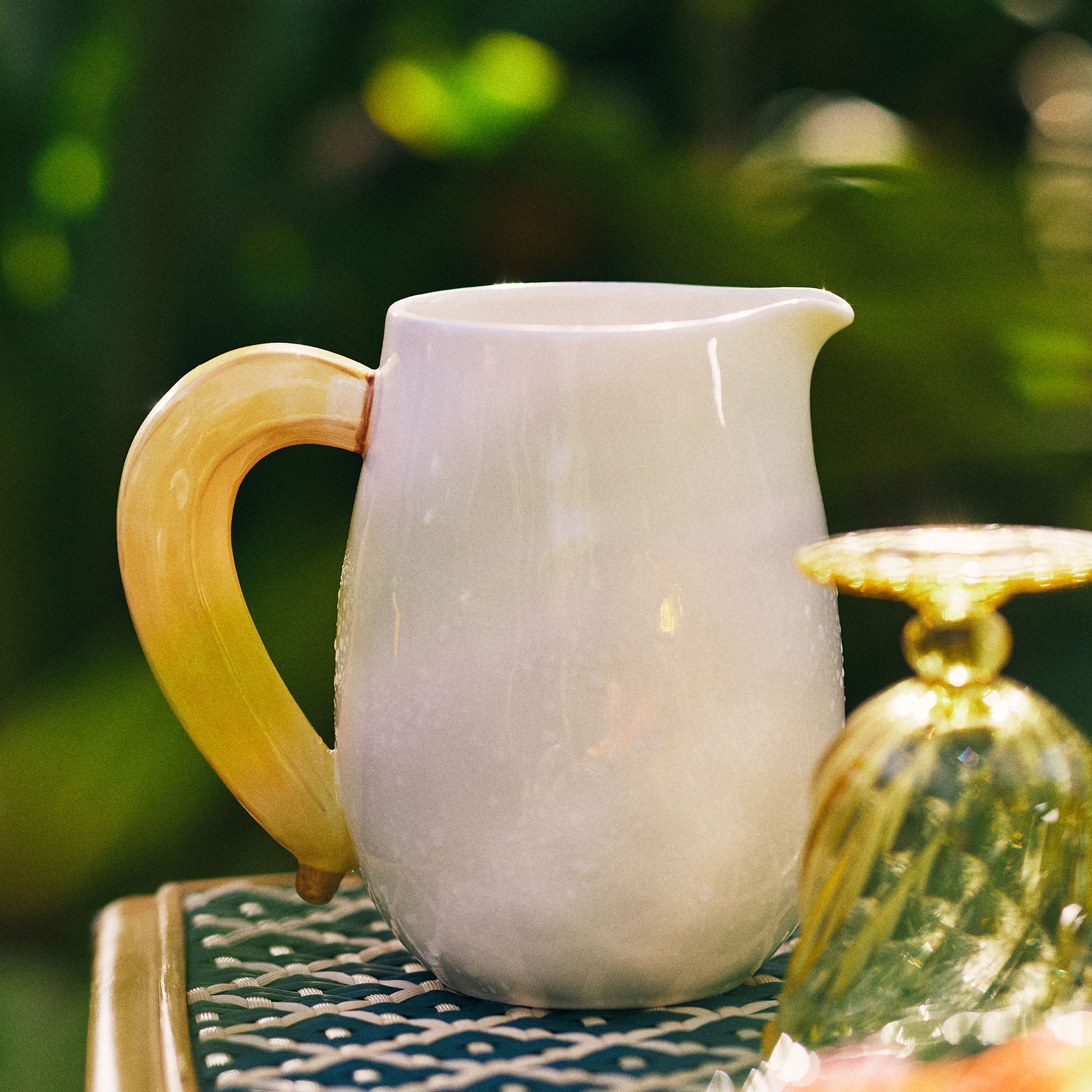 White ceramic jug with yellow banana handle