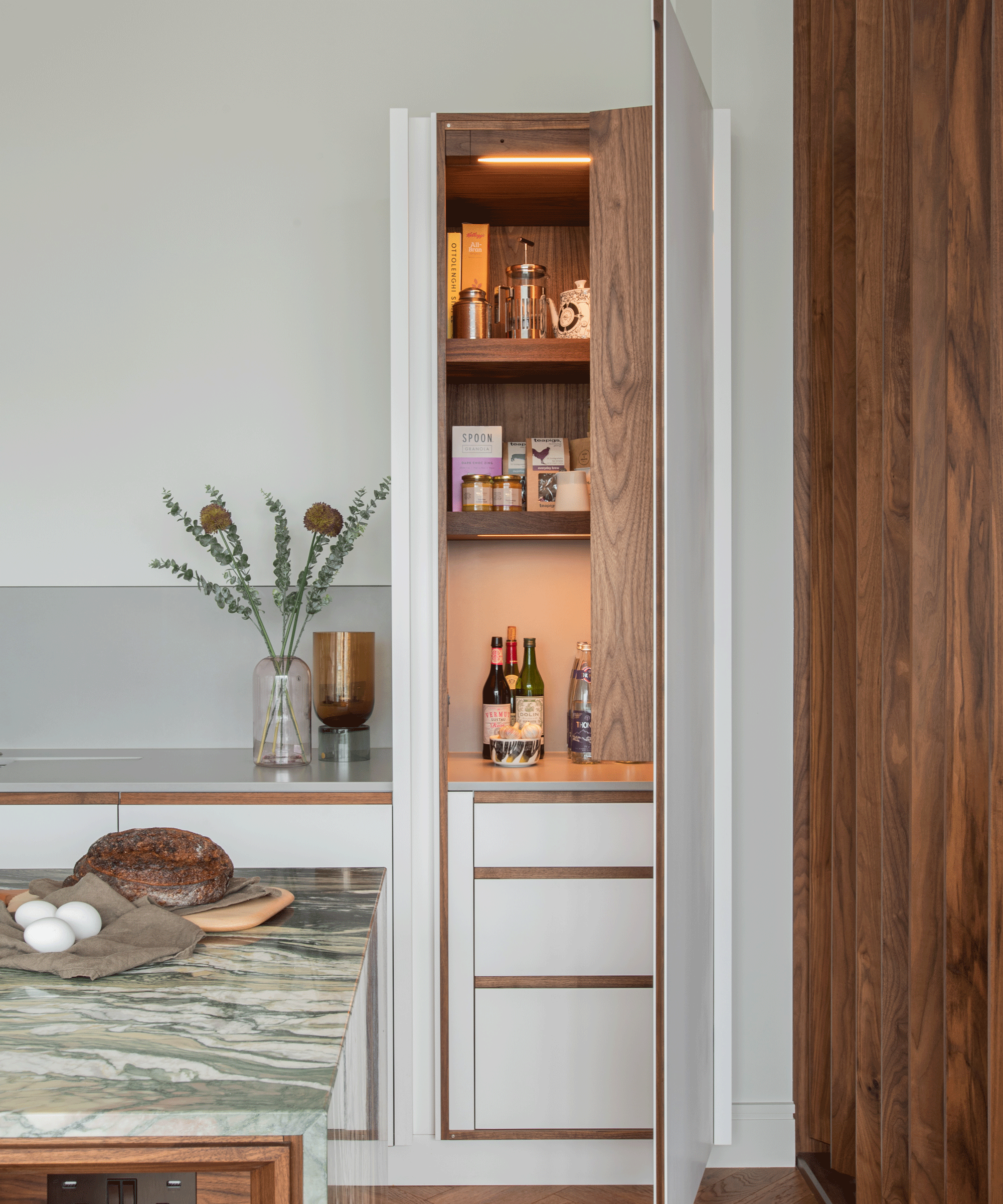 kitchen pantry with concealed lighting