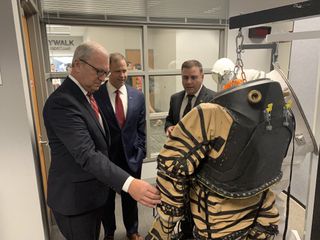 NASA Administrator Jim Bridenstine (center) reviews the NDX-1 pressurized spacesuit, made at the University of North Dakota, along with spacesuit principal investigator and UND professor Pablo de Leon (right). At left is North Dakota senator Kevin Cramer. In a tweet accompanying this picture taken on Sept. 4, 2019, Bridenstine said of the NASA-funded spacesuits, "The work being done here will benefit our #Artemis program to send humans to the Moon and our eventual missions to Mars and beyond."