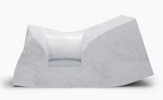 A Rectangular block of foam shaped solely through the pressure of the weight – and a refined marble seat