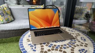 At home with 15-inch MacBook Air, on a mosaic balcony table and on a wooden floor.