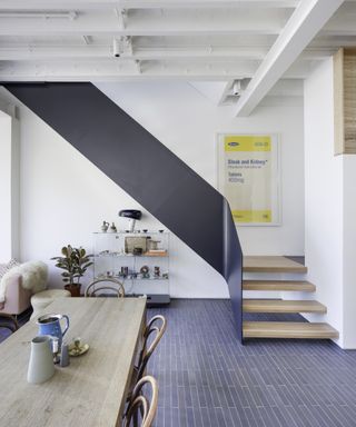 Brick style tile dark grey floors and modern staircase
