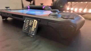 A mock-up of a T-Create microSD card and adapter against a Steam Deck
