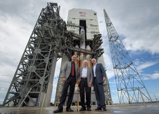 NASA Science Mission Directorate Associate Administrator Thomas Zurbuchen (left), solar astrophysicist Eugene Parker (center) and United Launch Alliance President Tory Bruno stand in front of NASA's Parker Solar Probe and its Delta IV Heavy rocket before the mission's Aug. 12, 2018 launch.