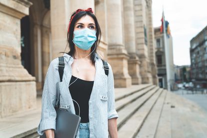 Post pandemic stress disorder: A woman in a mask looking anxious