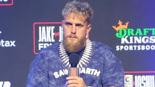 Jake Paul listening to a question during the press conference.