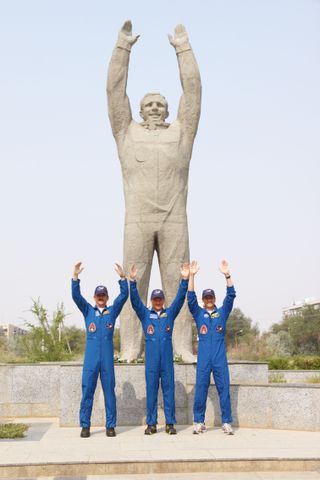 Expedition 32 Crew Members Pose at Gagarin Statue