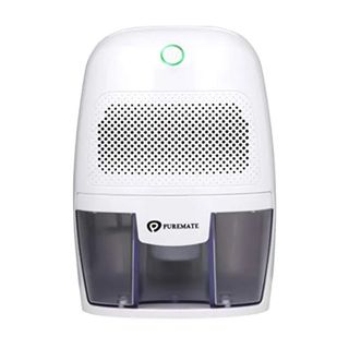 A compact white portable dehumidifier with a green, light up on off button at the top