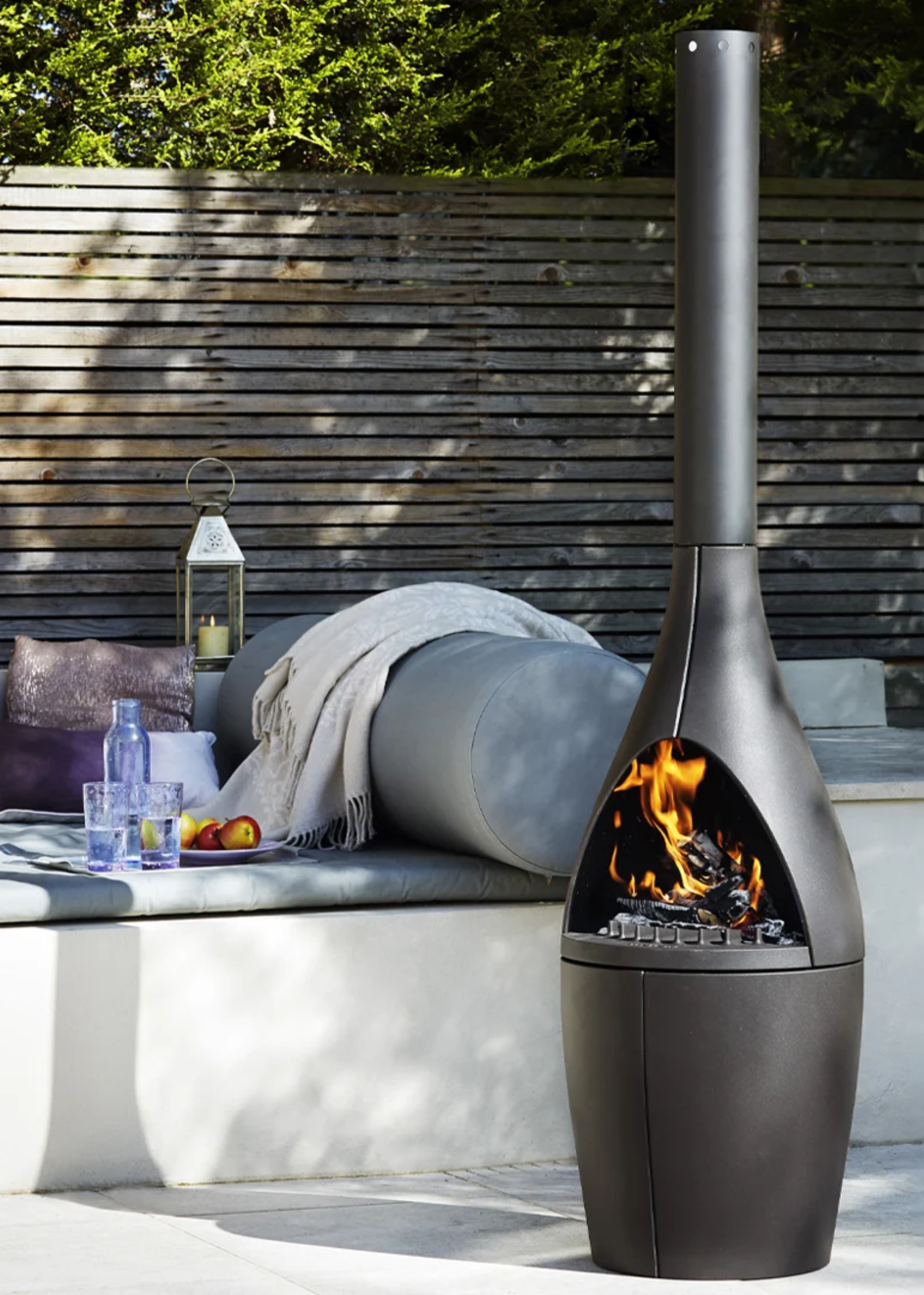 An outdoor space with a black chiminea
