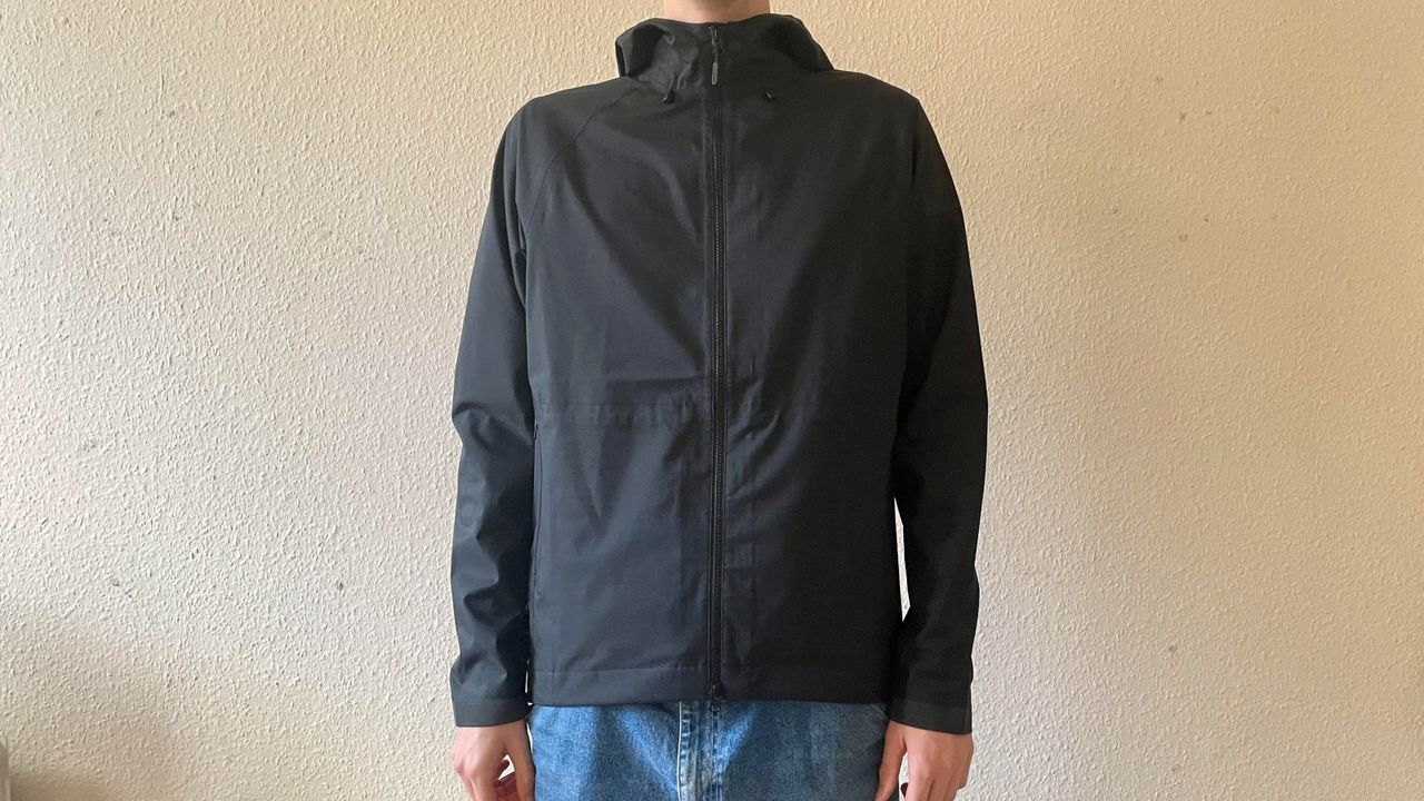 Person wearing black commuter jacket by Chrome Industries