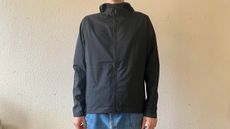 Person wearing black commuter jacket by Chrome Industries