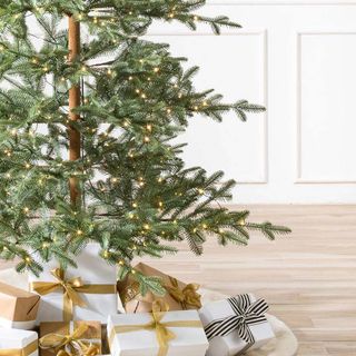 christmas tree with gift box and wooden flooring