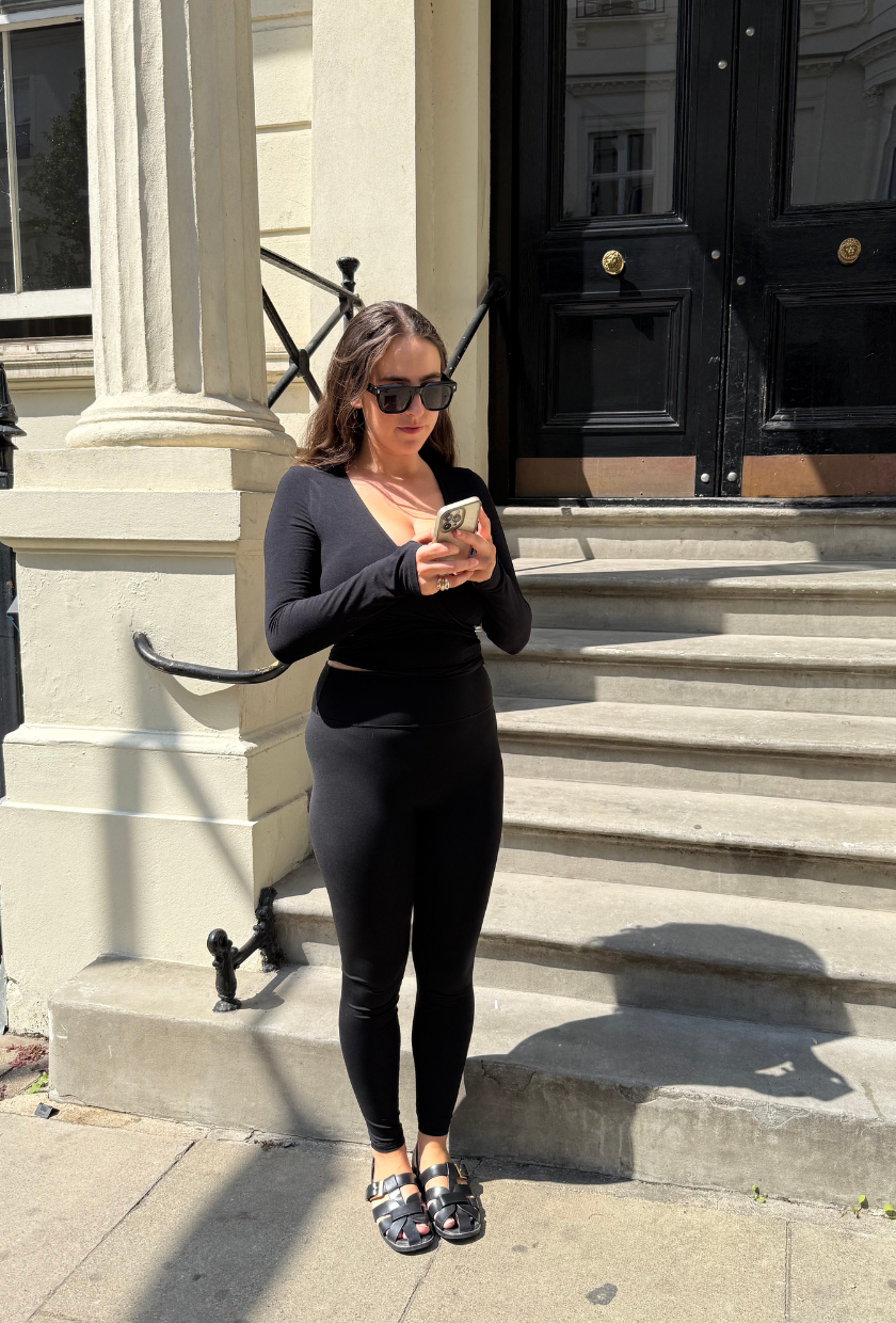An image of Who What Wear's Ava Gilchrist reviewing Adanola ultimate leggings.