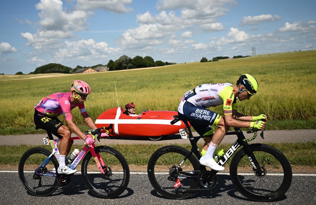 IntermarcheWantyGobert Materiaux teams Norwegian rider Erik Sven Bystrom R and EF EducationEasypost teams Danish rider Magnus Cort Nielsen L cycles in a breakaway past a spectator riding in a custom vehicle painted in Danish national colors during the 2nd stage of the 109th edition of the Tour de France cycling race 2022 km between Roskilde and Nyborg in Denmark on July 2 2022 Photo by Marco BERTORELLO AFP Photo by MARCO BERTORELLOAFP via Getty Images
