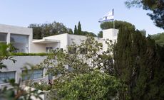 Villa Noailles. A large white building surrounded by trees.