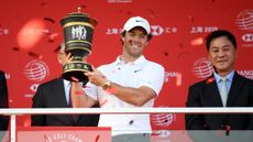 Rory McIlroy celebrates with 2019 WGC-HSBC Champions trophy