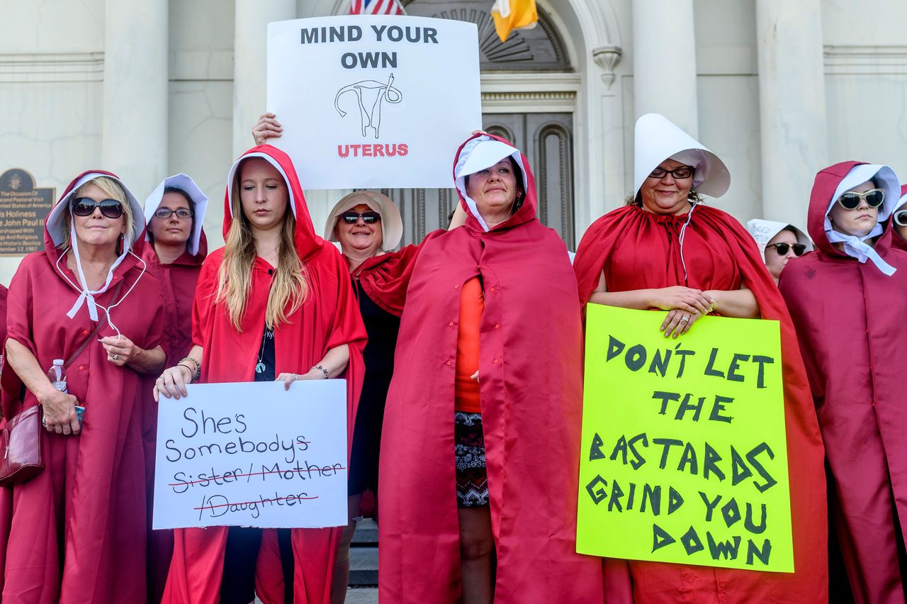 Handmaiden-themed protestors in Lousiana.