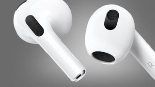 The Apple AirPods 3 earphones on a grey background