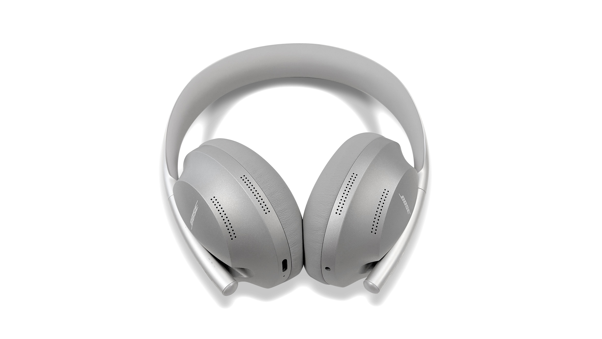 Bose 700 silver noise canceling headphones on white background.