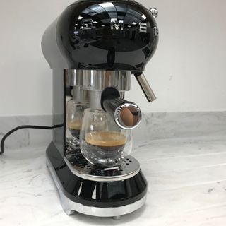 smeg espresso machine pulling an espresso shot