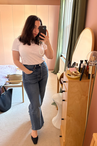 An image of Who What Wear UK editor-in-chief, Hannah Almassi, wearing one of the best white t-shirts.