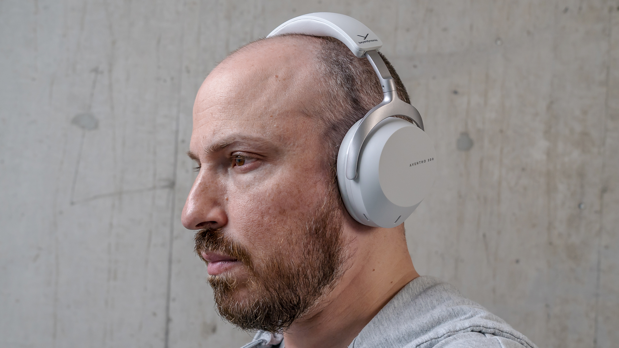 Wearing Beyerdynamic Aventho 300 headphones view from left side.
