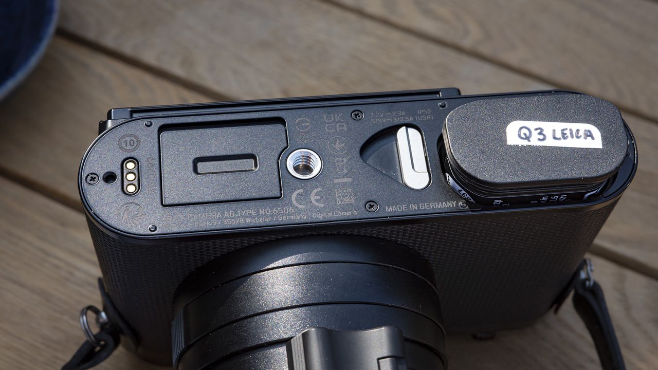 Leica Q3 camera underside with battery out